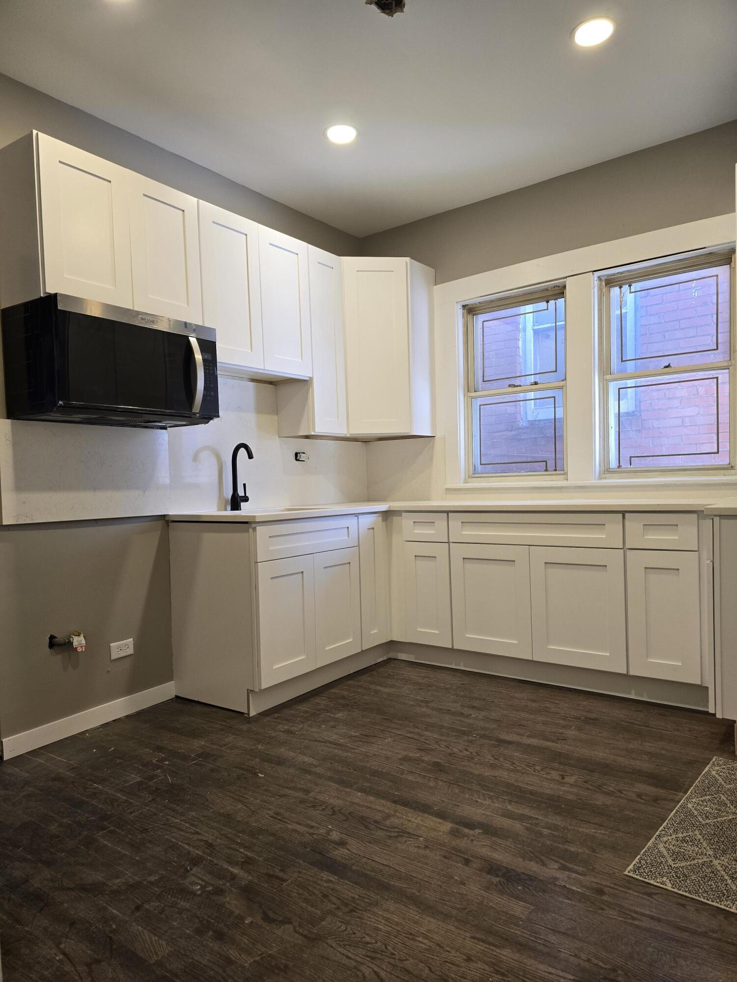 1168 Fillmore Street Gary, IN 46407 - Photo 7 of 22 a kitchen with a cabinets and window