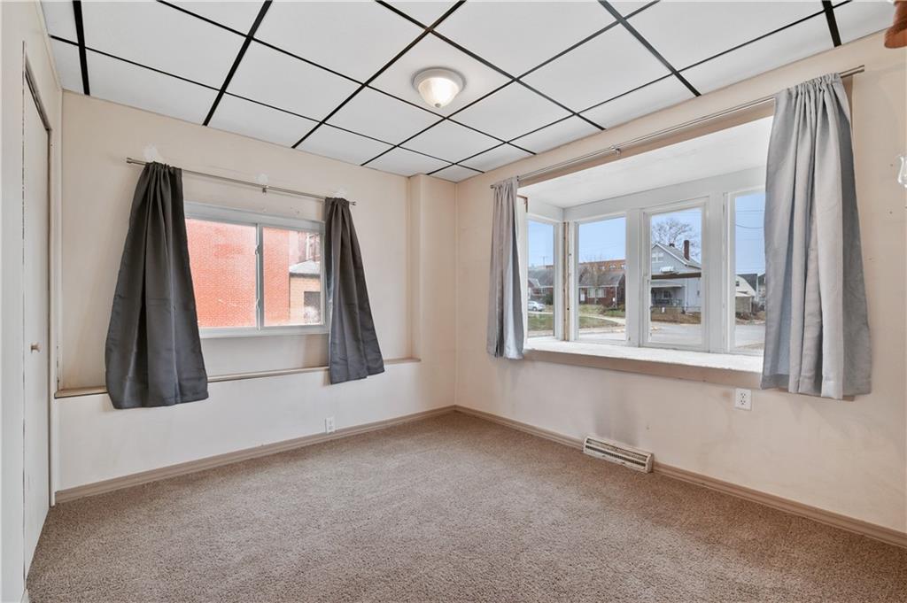 744 Lincoln Avenue Springdale, PA 15144 - Photo 15 of 26 an empty room with windows
