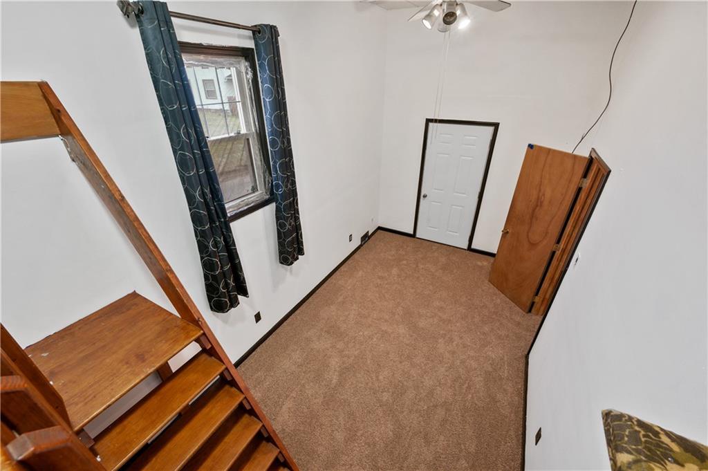 744 Lincoln Avenue Springdale, PA 15144 - Photo 17 of 26 a view of a hallway with mirror