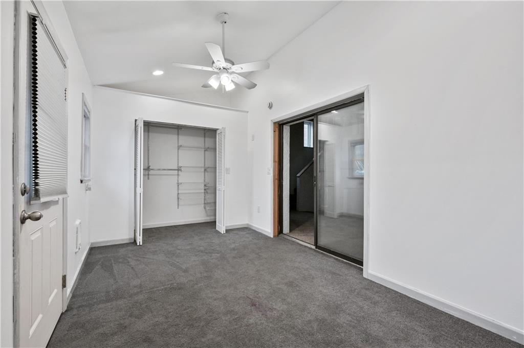 744 Lincoln Avenue Springdale, PA 15144 - Photo 19 of 26 an empty room with closet and a chandelier fan