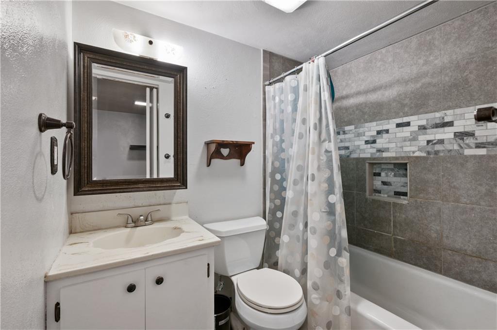 744 Lincoln Avenue Springdale, PA 15144 - Photo 21 of 26 a bathroom with a sink a toilet and shower