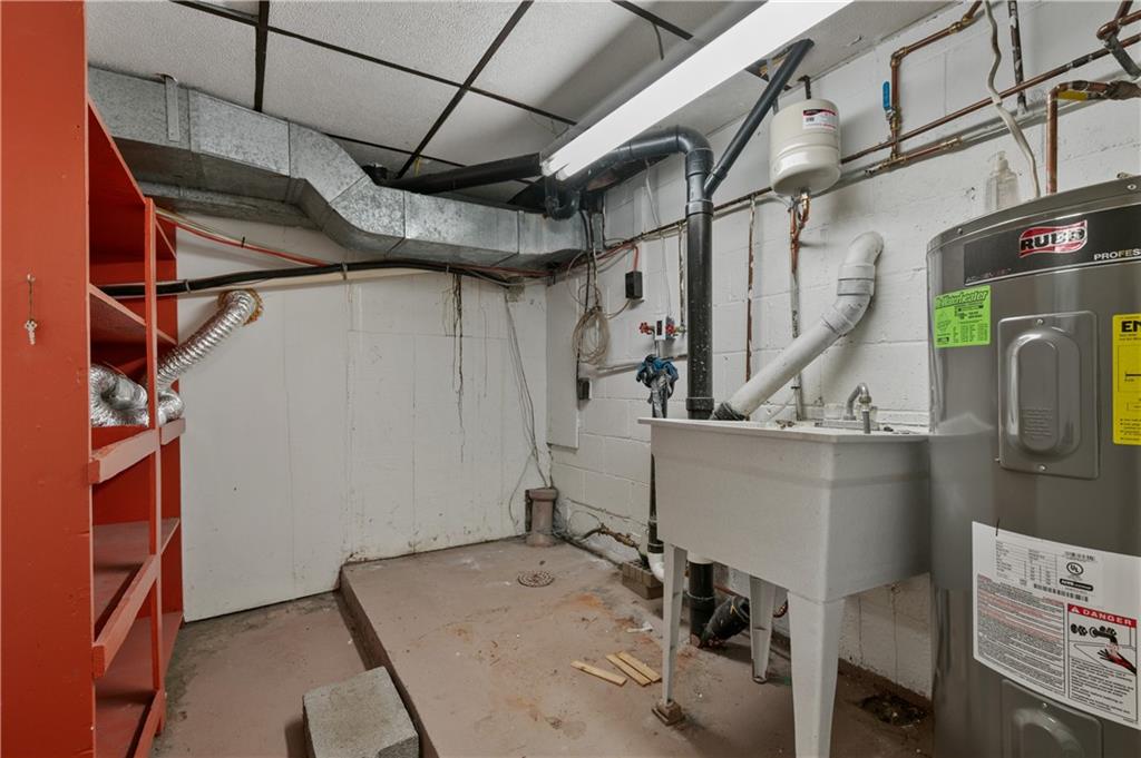744 Lincoln Avenue Springdale, PA 15144 - Photo 24 of 26 a utility room with cabinets