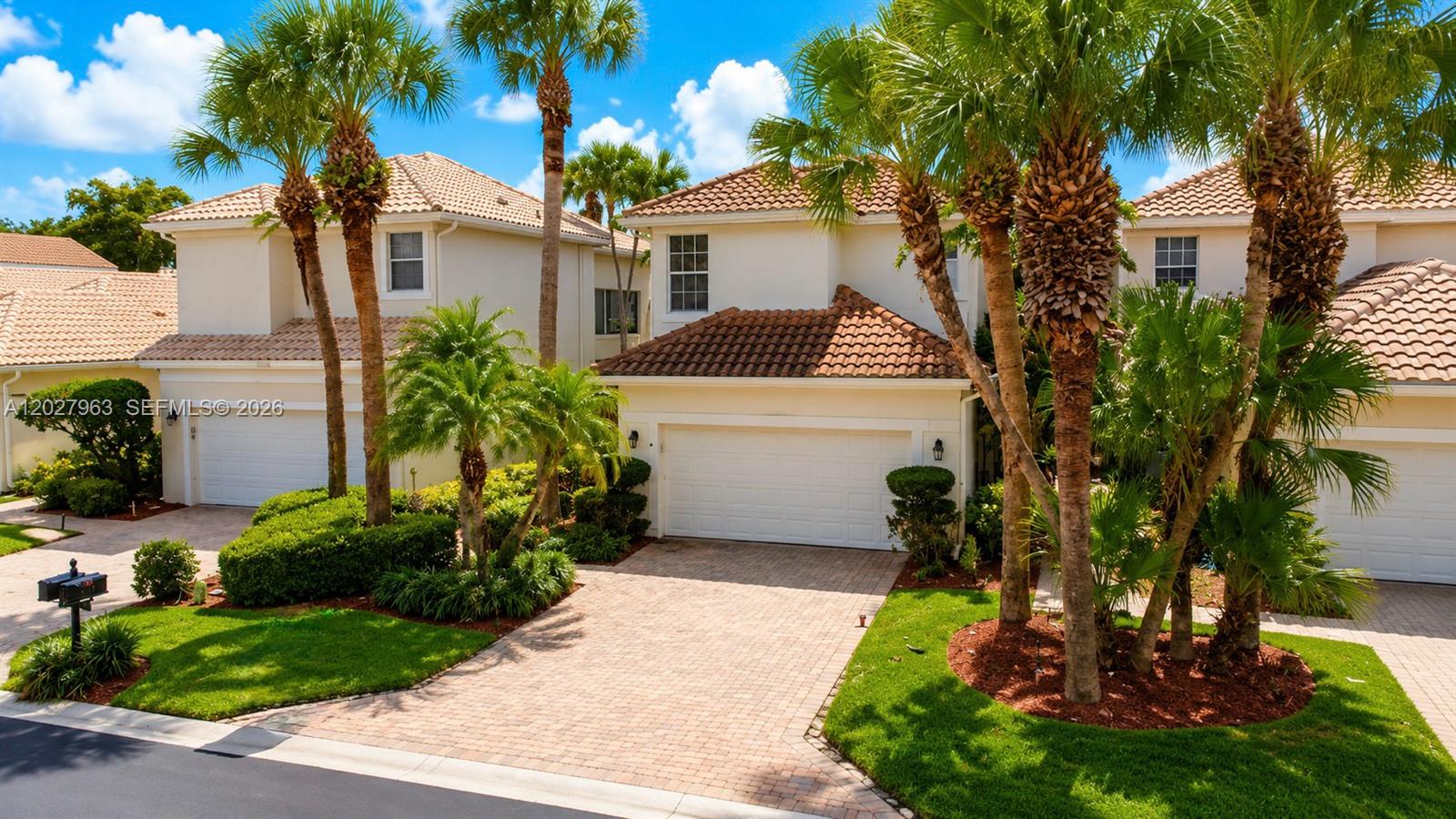 6646 Northwest 25th Terrace Boca Raton, FL 33496 - Photo 40 of 48 a view of a white house with a yard and potted plants