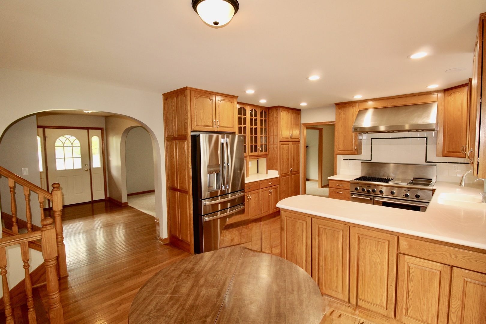 1505 Pheasant Run Road Harvard, IL 60033 - Photo 15 of 30 a kitchen with stainless steel appliances granite countertop a refrigerator a stove and a wooden floors