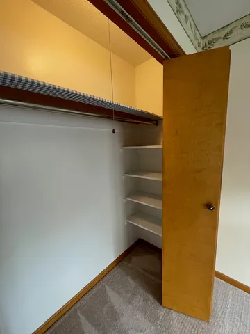 a view of front door with wooden floor