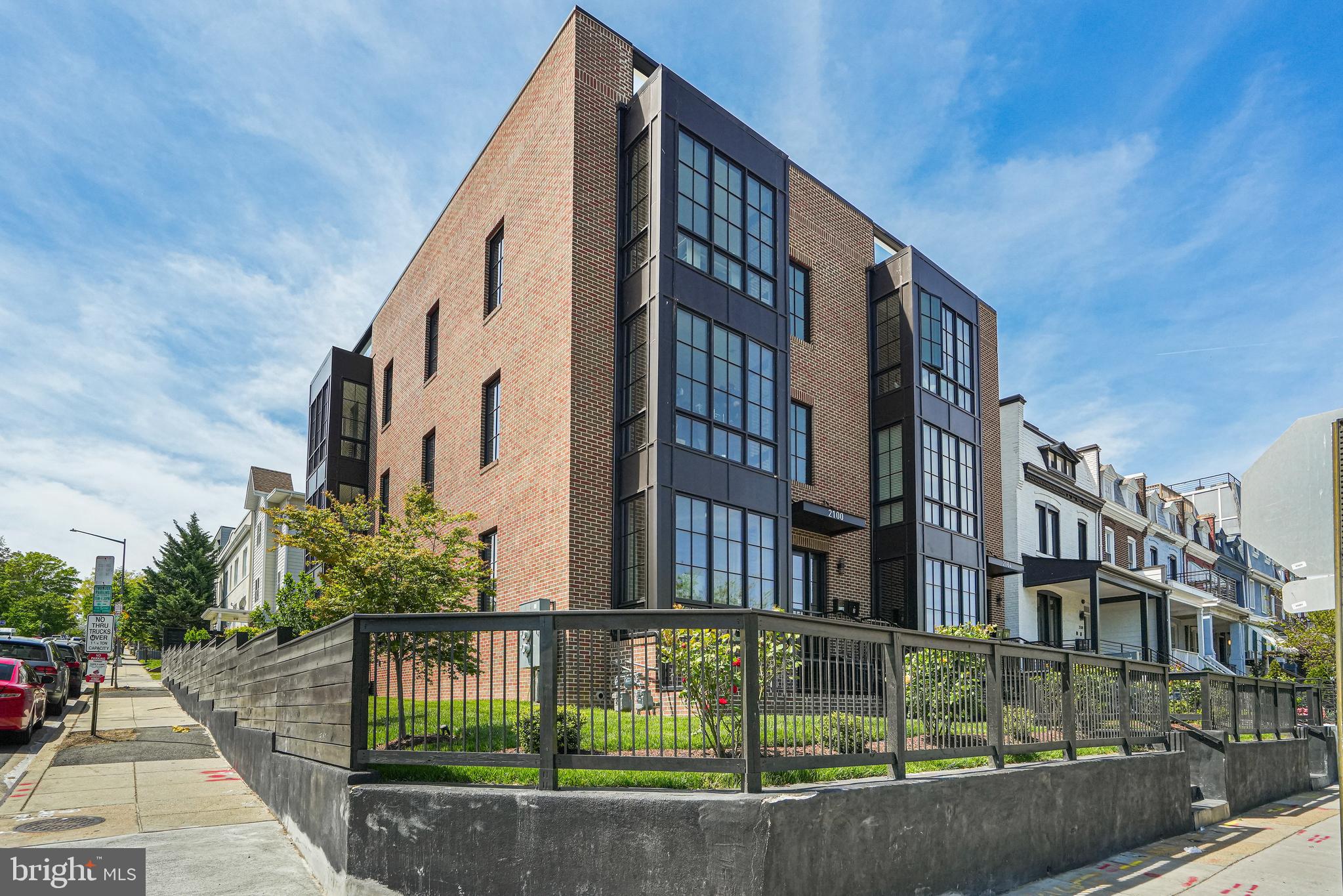 2100 4th Street Northeast, Unit 1 Washington, DC 20002 - Photo 1 of 34 a front view of a house with a garden