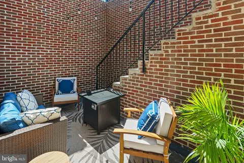 a view of a chairs and table in a patio