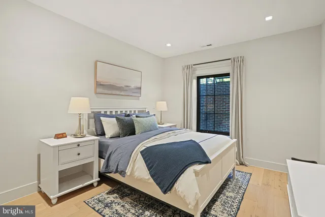 a bedroom with a bed and a window