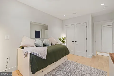 a bedroom with a bed and a dresser
