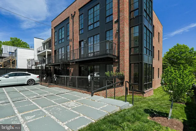 a view of a building with a yard