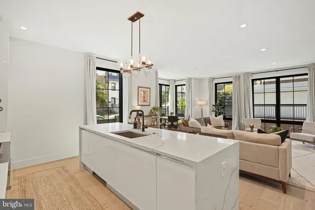 a view of living room with granite countertop furniture and a chandelier