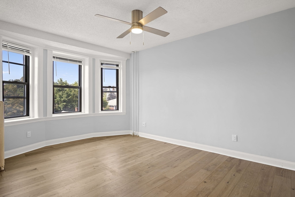 285 Lynn Shore Drive, Unit 508 Lynn, MA 01902 - Photo 5 of 18 a view of wooden floor and windows in a room