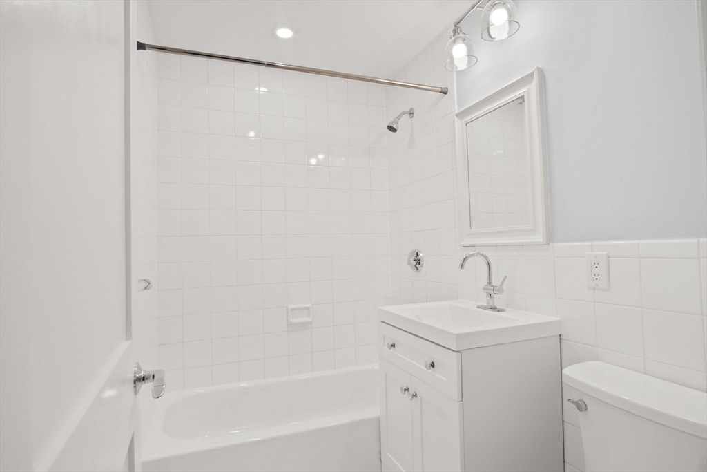 285 Lynn Shore Drive, Unit 508 Lynn, MA 01902 - Photo 8 of 18 a bathroom with a sink and a mirror