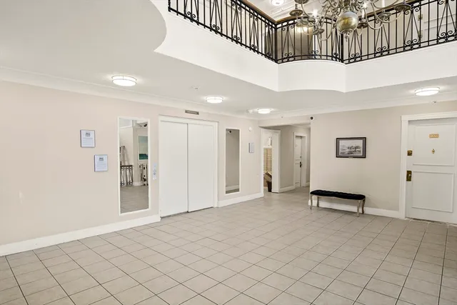 a view of an entryway with wooden floor