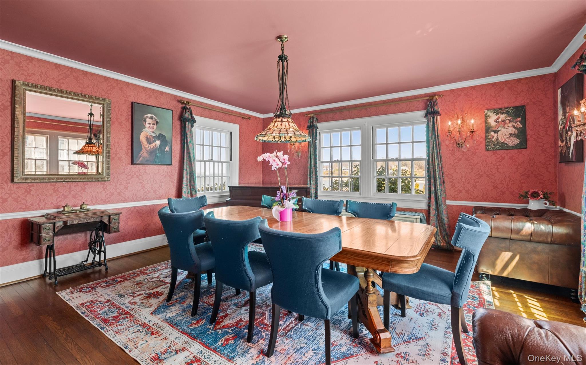 11-20 Shore Road Queens, NY 11363 - Photo 15 of 46 a dining room with furniture a chandelier and wooden floor