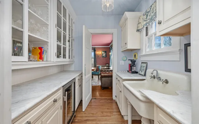 a kitchen with stainless steel appliances granite countertop a sink and a stove
