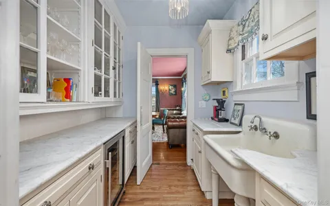 a kitchen with stainless steel appliances granite countertop a sink and a stove