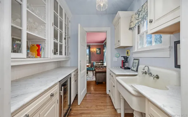 a kitchen with stainless steel appliances granite countertop a sink and a stove