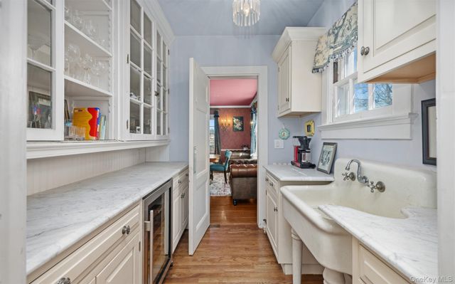 a kitchen with stainless steel appliances granite countertop a sink and a stove