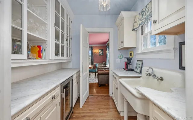a kitchen with stainless steel appliances granite countertop a sink and a stove