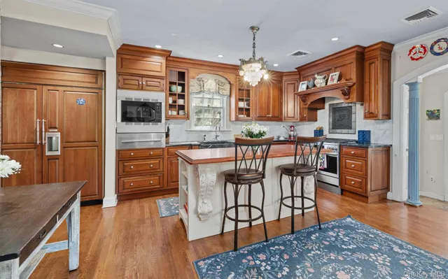 a kitchen with a refrigerator and a sink