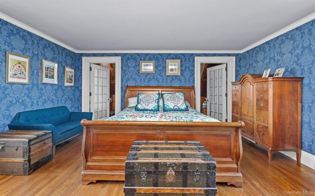 a bedroom with a bed and a dresser