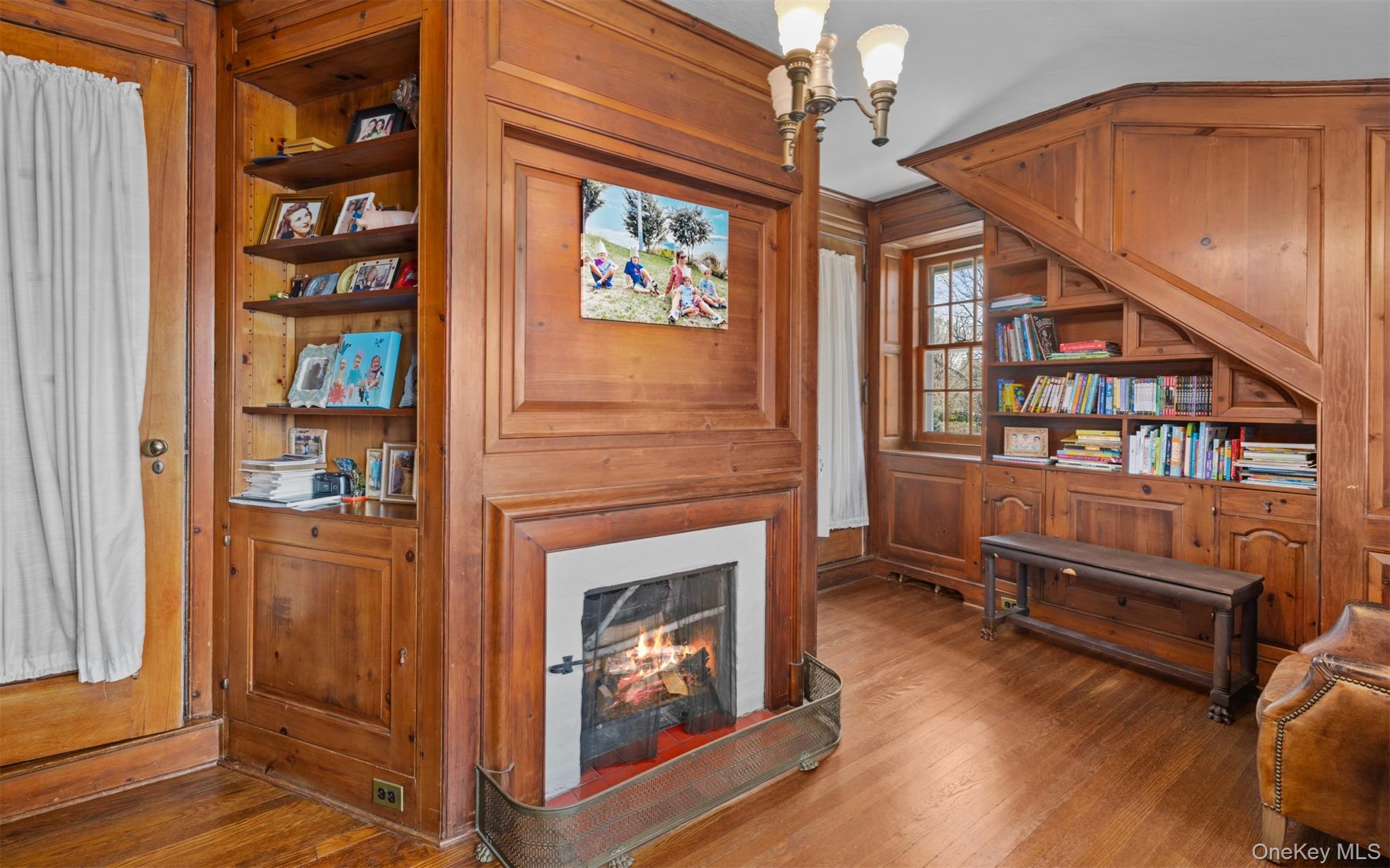 11-20 Shore Road Queens, NY 11363 - Photo 30 of 46 a living room with furniture and a fireplace