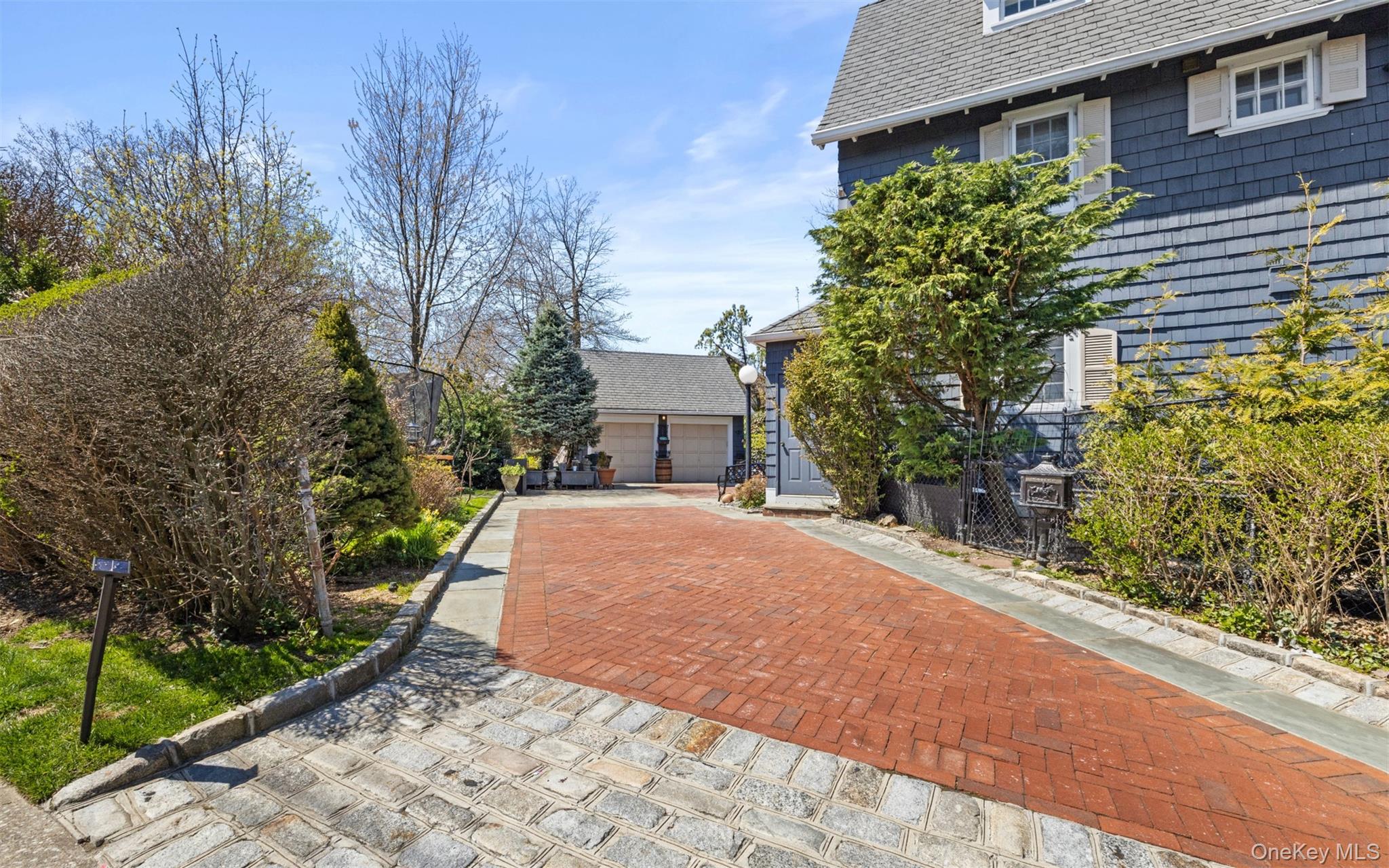 11-20 Shore Road Queens, NY 11363 - Photo 35 of 46 a house with a yard and a wooden fence