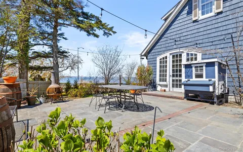 a view of a lake with a house in the background