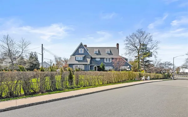 a view of a street in front of a house