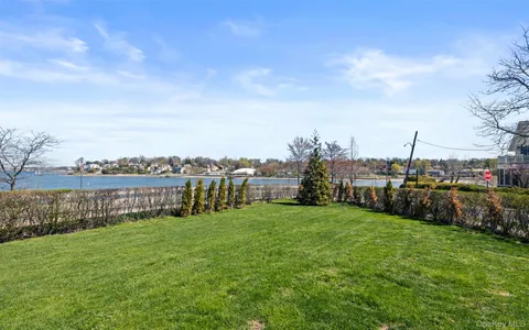 a view of a garden with houses