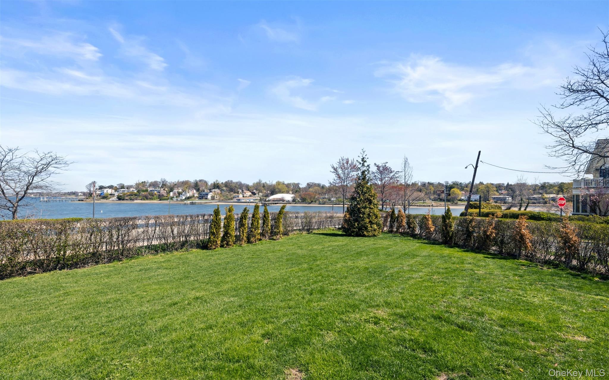 11-20 Shore Road Queens, NY 11363 - Photo 5 of 46 a view of a garden with houses