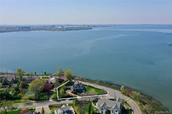 an aerial view of a house with lake view