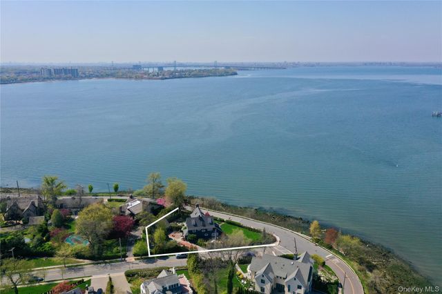 an aerial view of a house with lake view