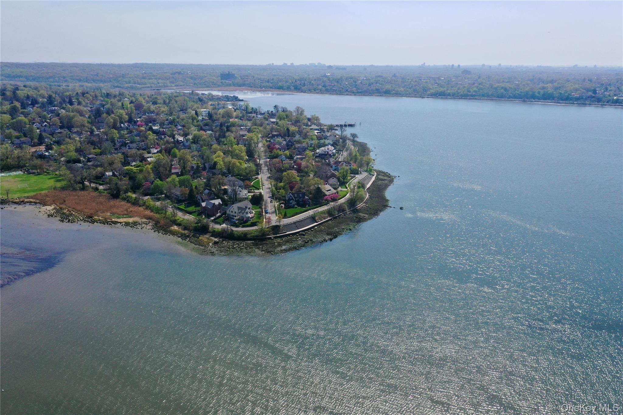 11-20 Shore Road Queens, NY 11363 - Photo 8 of 46 a view of a lake with a mountain in the back