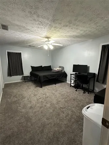 a view of a livingroom with furniture