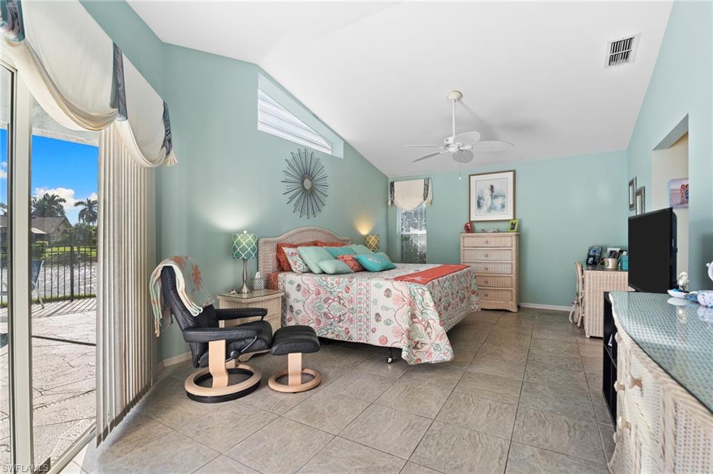 200 St James Way Naples, FL 34104 - Photo 16 of 45 Bedroom featuring access to outside, a ceiling fan, light tile patterned floors, and high vaulted ceiling
