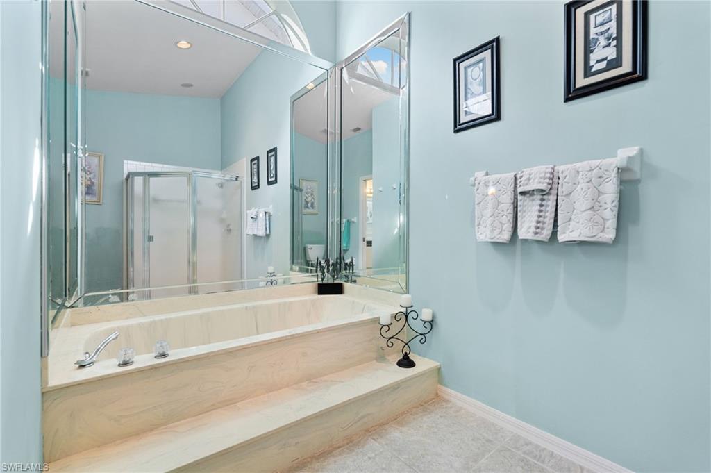 200 St James Way Naples, FL 34104 - Photo 20 of 45 Bathroom featuring a walk in shower and tile patterned floors
