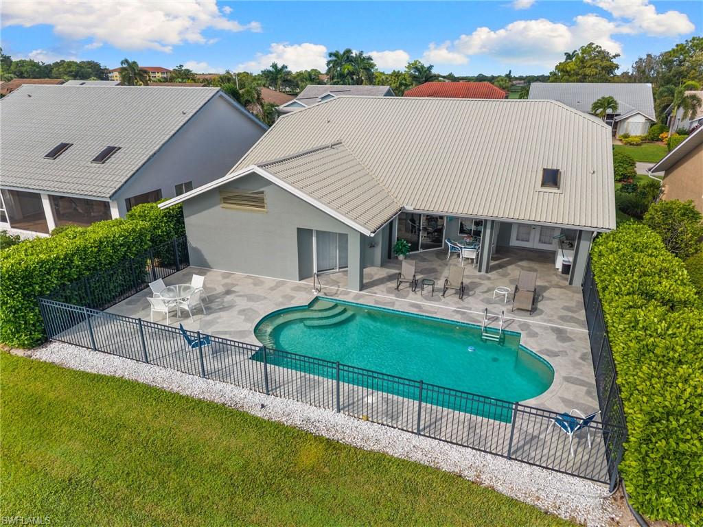 200 St James Way Naples, FL 34104 - Photo 31 of 45 View of pool with a patio area, a residential view, and outdoor dining space