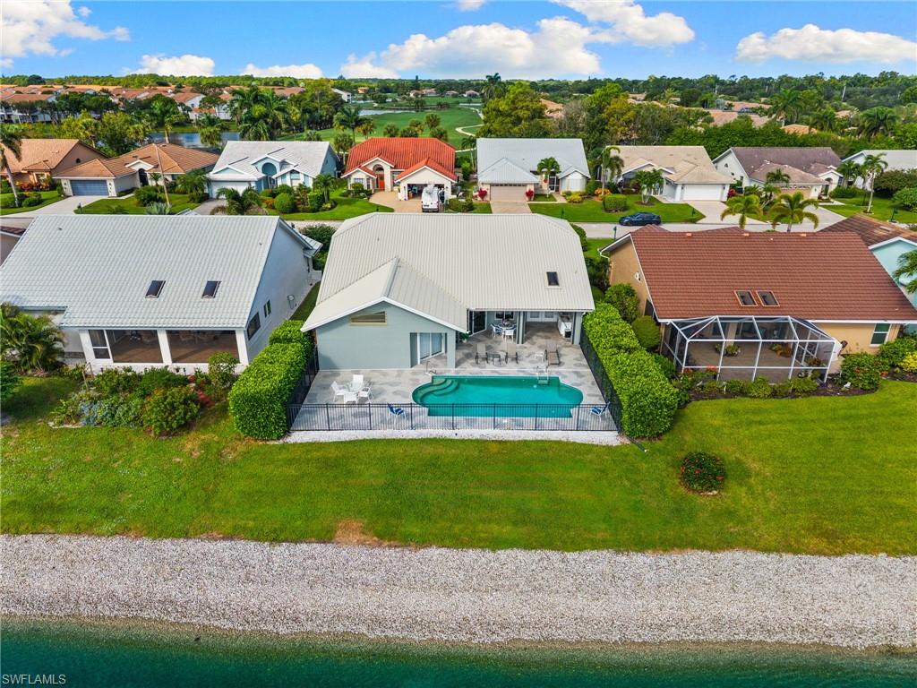200 St James Way Naples, FL 34104 - Photo 32 of 45 Aerial view of residential area featuring a pool area