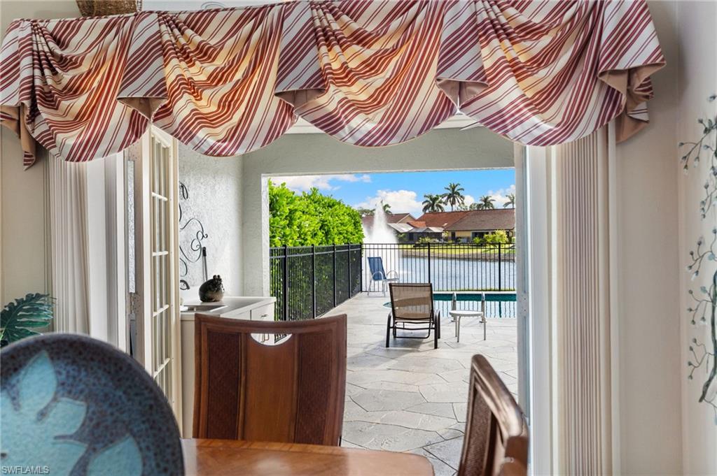 200 St James Way Naples, FL 34104 - Photo 6 of 45 Balcony with a water view and view of pool area