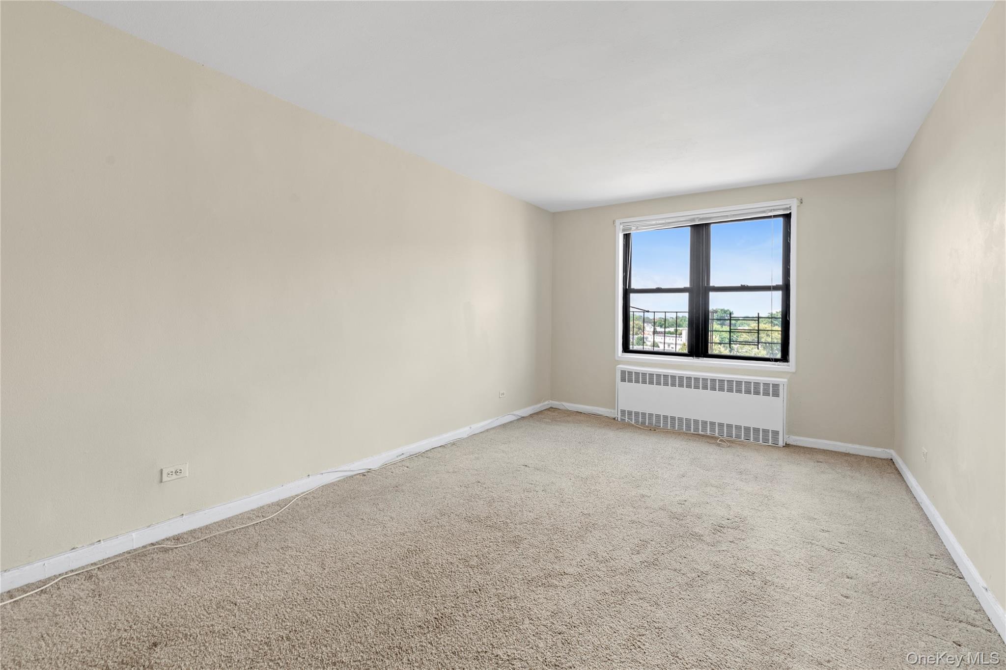 150-11 72nd Road, Unit 6E Queens, NY 11367 - Photo 3 of 13 an empty room with windows
