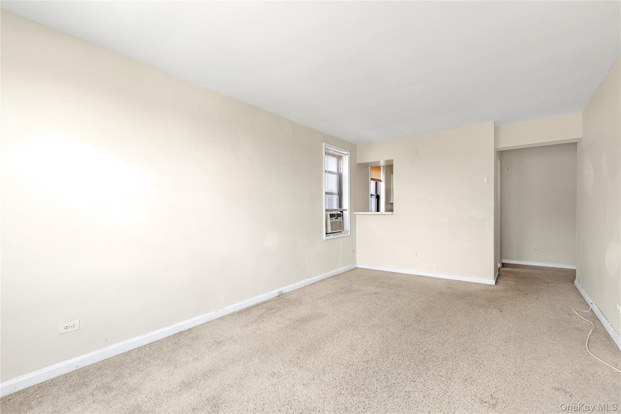 150-11 72nd Road, Unit 6E Queens, NY 11367 - Photo 4 of 13 an empty room with windows