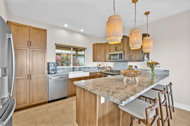 a living room with dining table and a large window