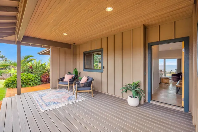 a living room with furniture ceiling fan and a window