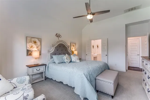 a bedroom with a bed couch and window