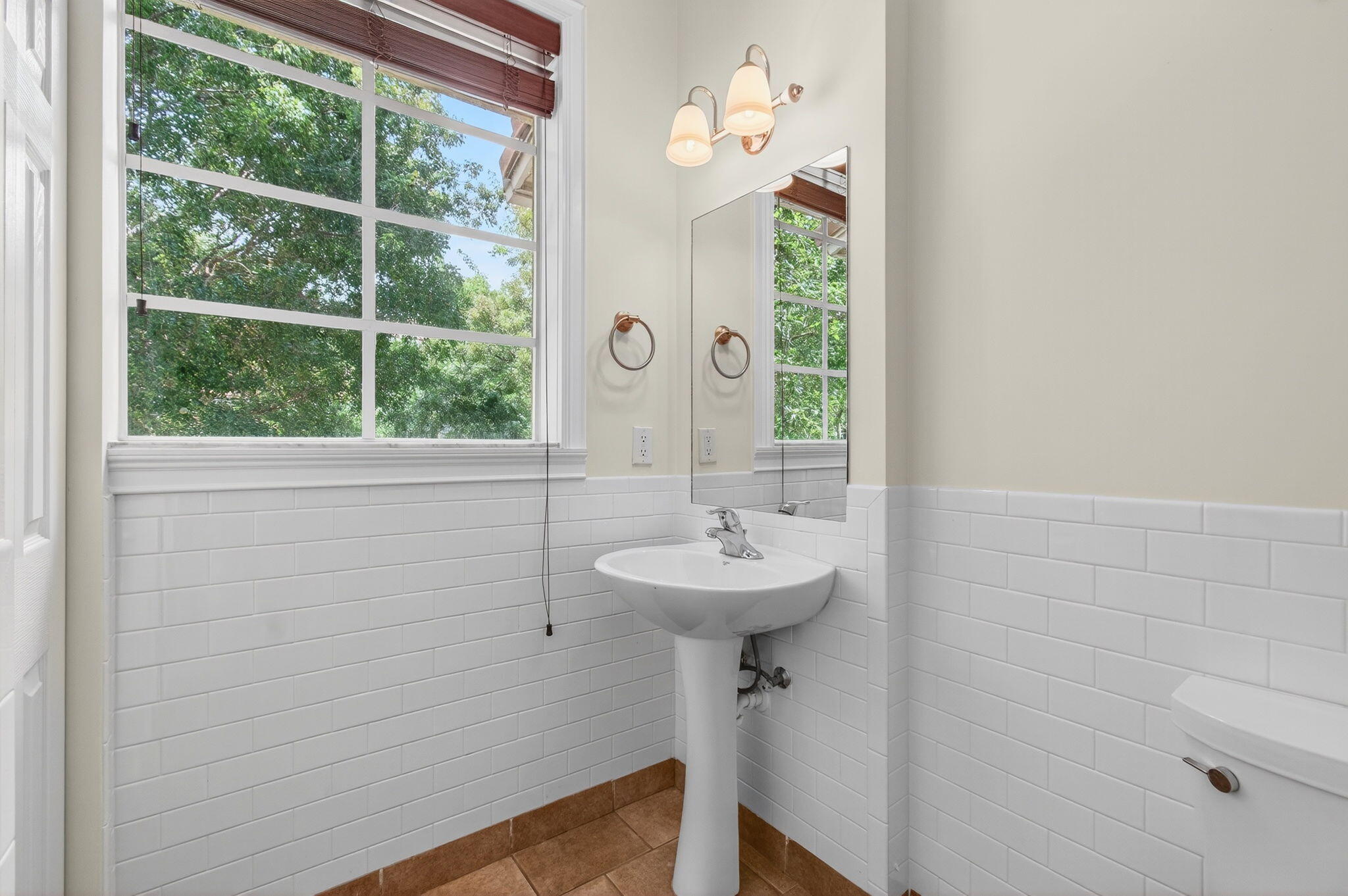 4582 Danson Way Delray Beach, FL 33445 - Photo 19 of 74 a bathroom with a sink a mirror and window