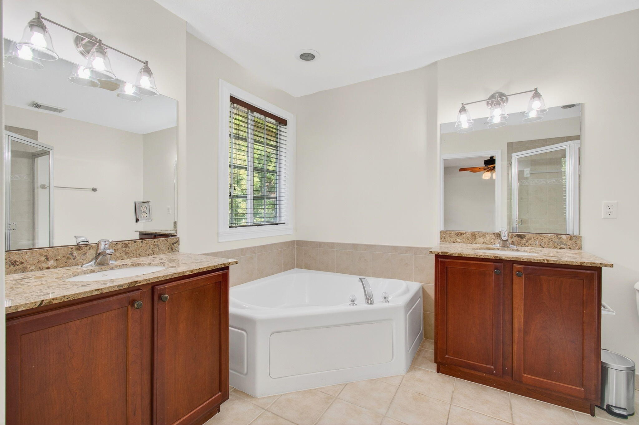 4582 Danson Way Delray Beach, FL 33445 - Photo 27 of 74 a bathroom with a granite countertop tub sink and mirror