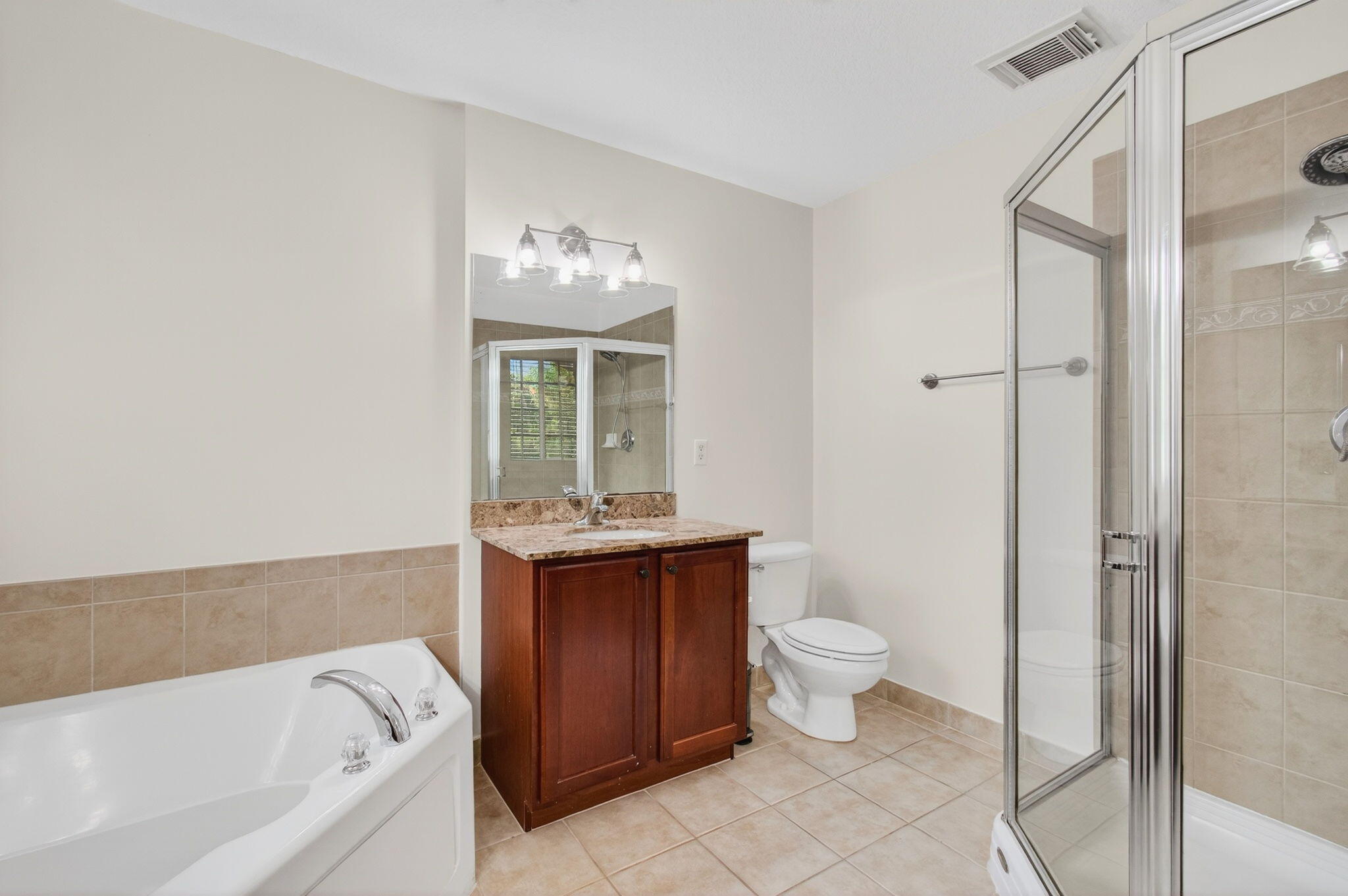 4582 Danson Way Delray Beach, FL 33445 - Photo 28 of 74 a bathroom with a toilet sink and mirror
