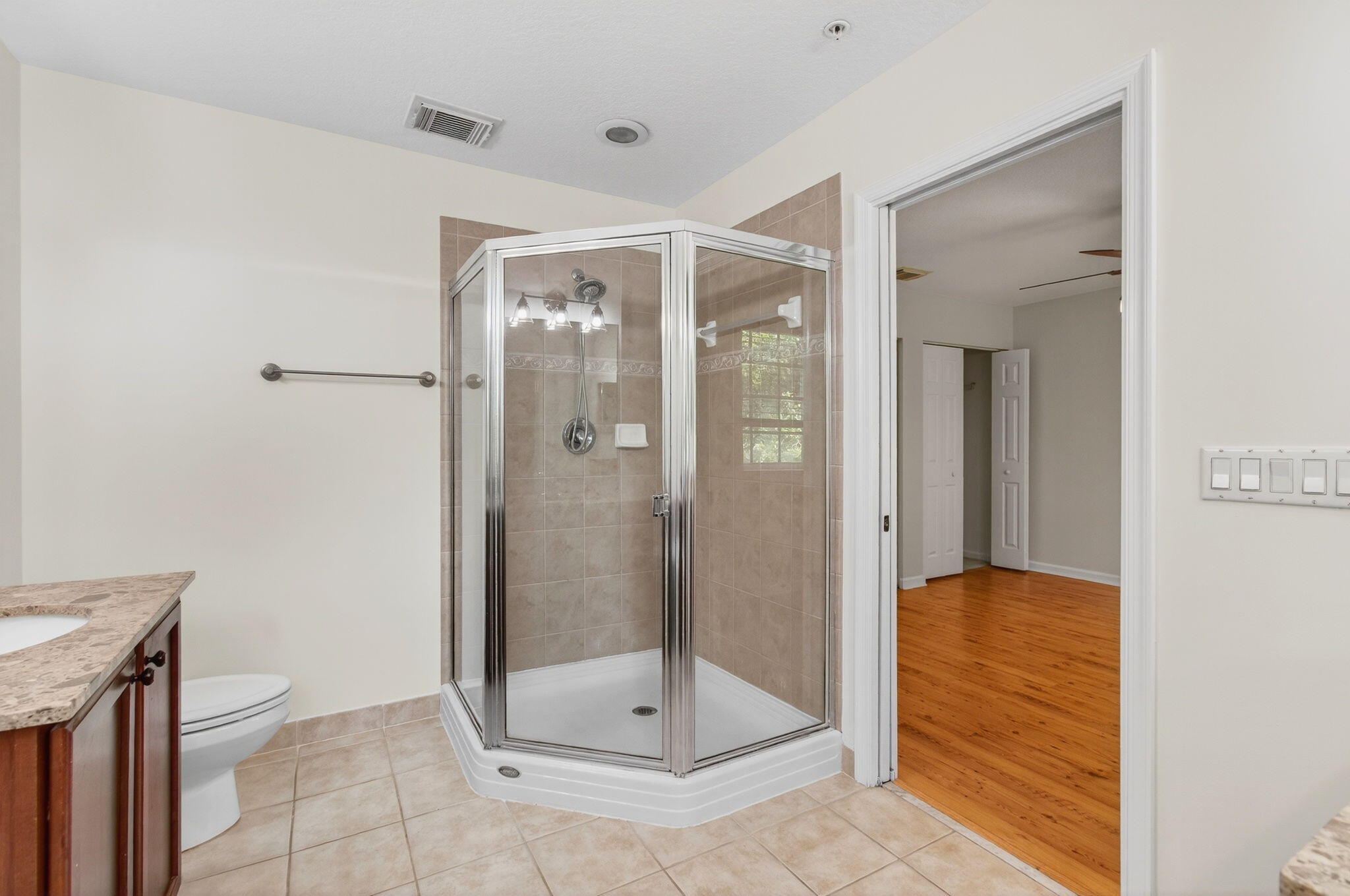 4582 Danson Way Delray Beach, FL 33445 - Photo 30 of 74 a view of a bathroom with a glass door shower